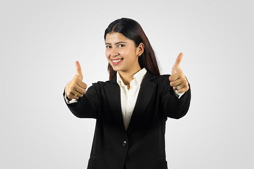 Beautiful and Happy Smiling Asian Young Girl from Nepal giving several gestures in a formal dress