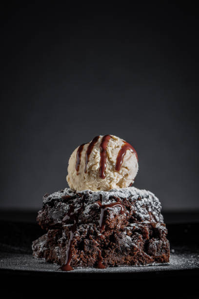 istock Chocolate brownies and ice cream 1702499705