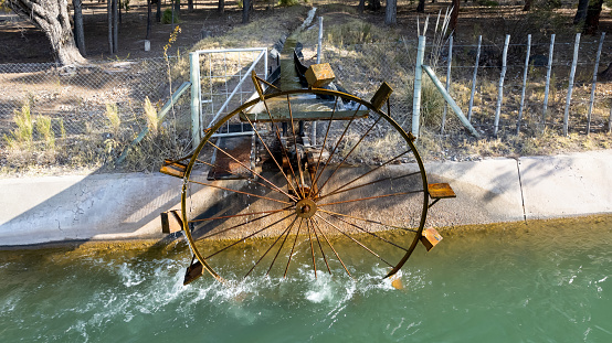 Ferris wheel drawing water from the river to irrigate.