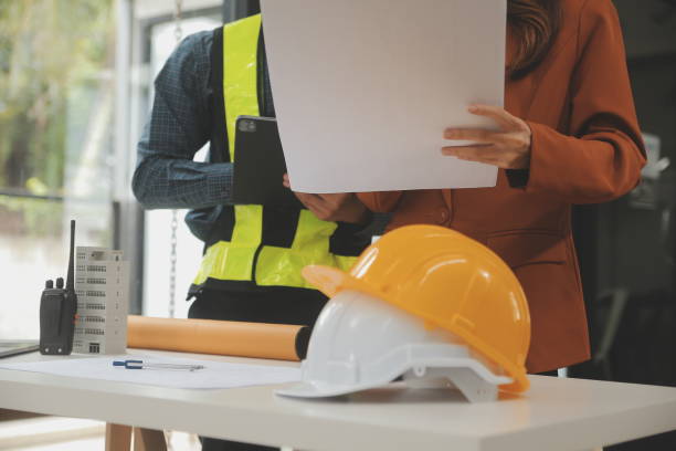 istock Engineer Teamwork Meeting, Drawing working on blueprint meeting for project working with partner on model building and engineering tools in working site, Construction and structure concept. 1702519311