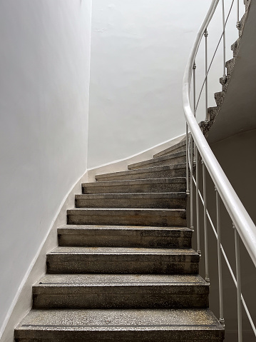 Shot of spiral steps in a building with potted plants