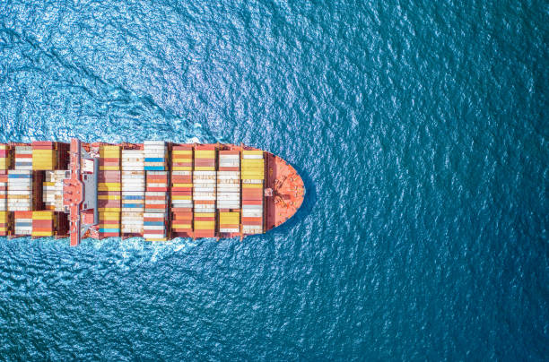 istock Top view Logistics and transportation of Container Cargo ship and Cargo plane in shipyard at sunrise, logistic import export and transport industry background 1702543756