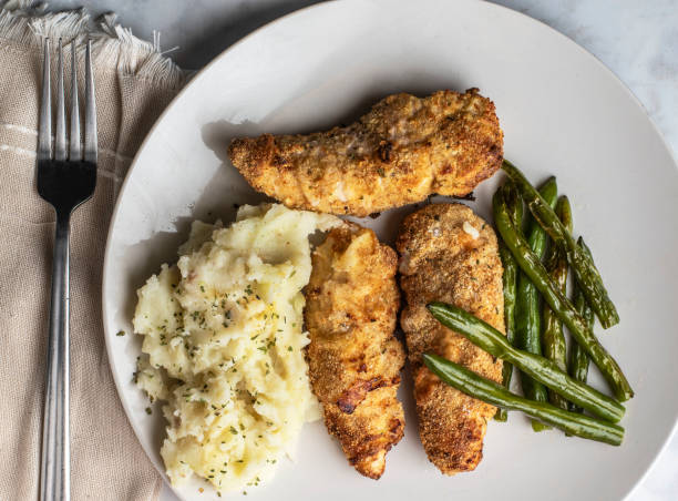 istock chicken tenders with mashed potatoes and sauteed green beans 1702546007