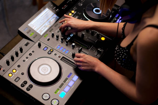 istock Female disc jockey mixing tracks 1702552251