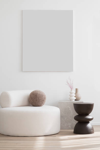 istock Empty canvas, artwork mockup in interior design. Blank picture frame on a wall. Vertical orientation 1702561293