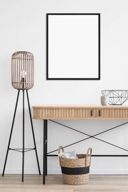 istock Artwork mockup in interior design. Blank picture frame on a wall. Vertical orientation 1702561297