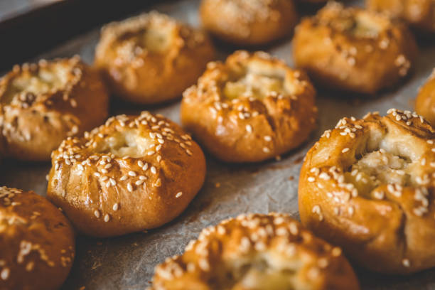istock Homemade freshly baked buns background top view 1702568981
