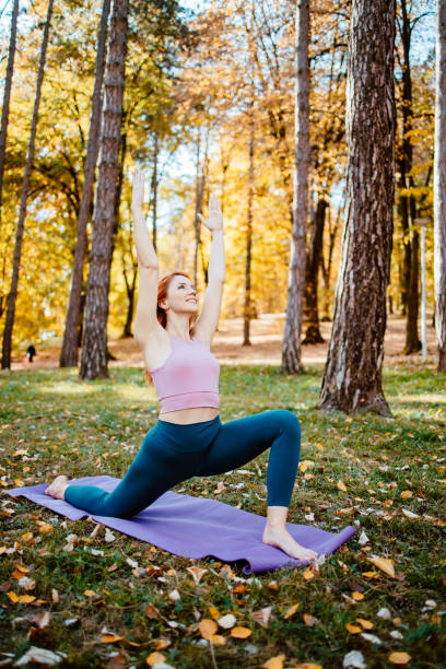 istock Beautiful woman practicing Yoga in nature 1702588986