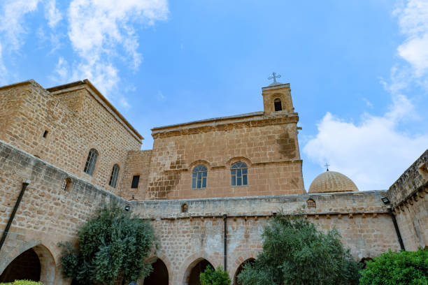 istock Mor Hananyo Monastery in Mardin Turkey with sunset sky. 1702597957