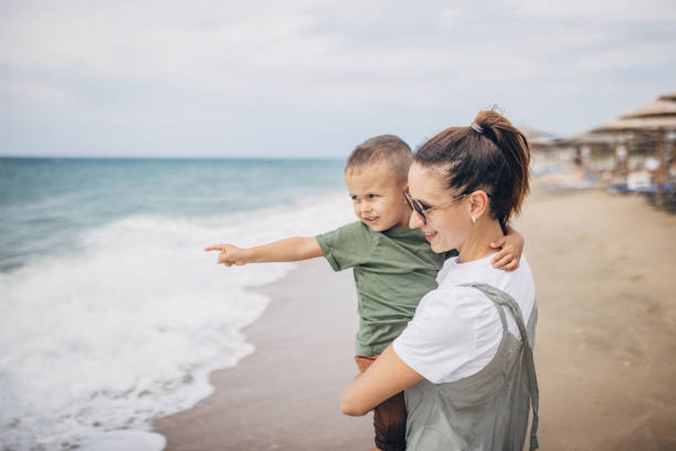 istock Woman with son on vacation 1702614095