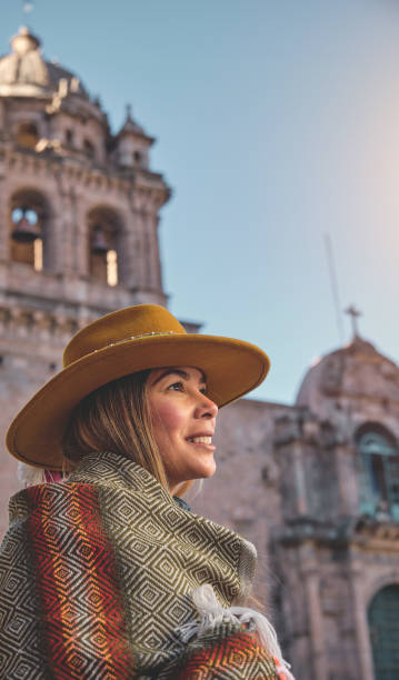 istock Happy woman sightseeing around Cusco around the Cathedral 1702616448