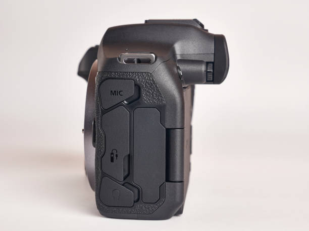 istock Digital mirrorless camera, side view of connectors. Microphone, headphones, HDMI, USB, remote control. 1702628935