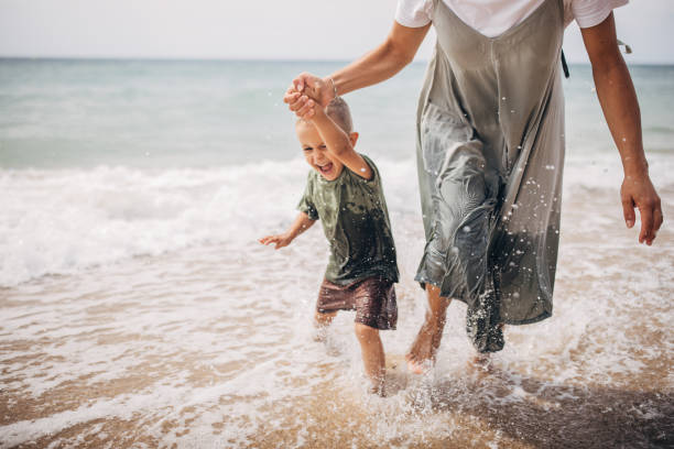 istock Woman playing with son 1702630554