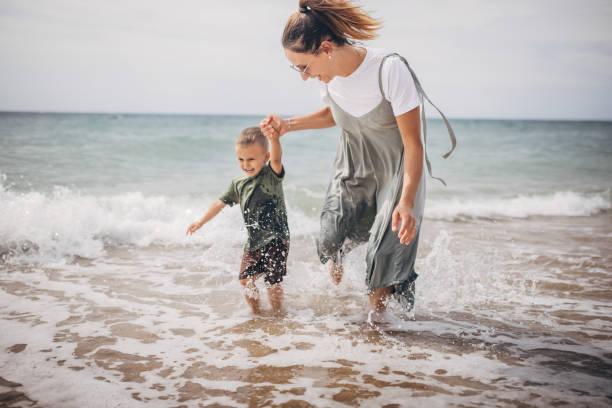 istock Woman playing with son 1702630570