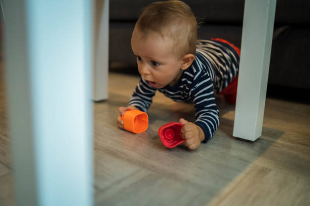 istock Baby boy playing with toys 1702636071
