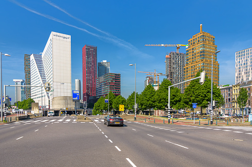 Rotterdam, Netherlands - June 4, 2021: View of the Maasboulevard in Rotterdam. Rotterdam has an impressive skyline with many tall buildings.