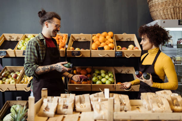 istock Two salespeople working in grocery shop 1702651905