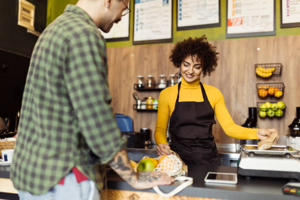 istock Man shopping grocery in the small store 1702652278