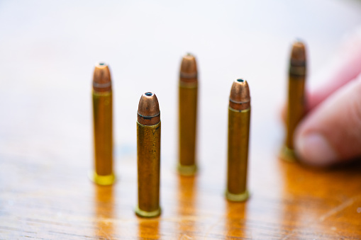 This is a photograph of .22 Caliber bullet cartridges set on a table top in Florida, USA.