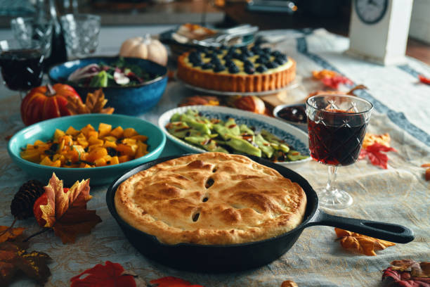 istock Vegan Thanksgiving Dinner with Pumpkin & Kale Pot Pie, Butternut Squash, Roasted Green Beans with Almond Bacon, Radicchio Clementine Salad and Berry Pie 1702680549
