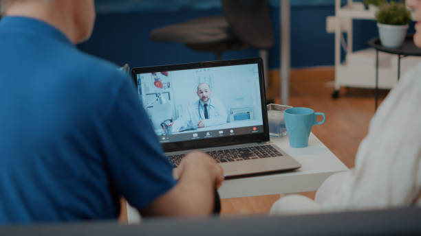 istock Retired couple doing online consultation on video call with medic 1702692834
