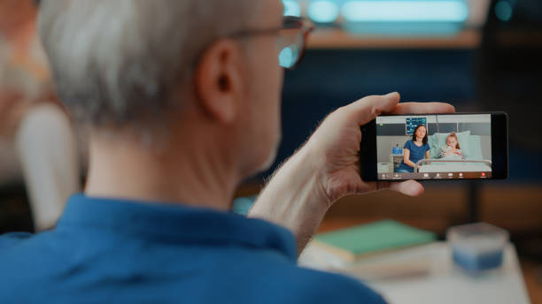 istock Retired adult using online video call on mobile phone 1702695672