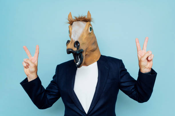 istock Man with mask and horse 1702696775