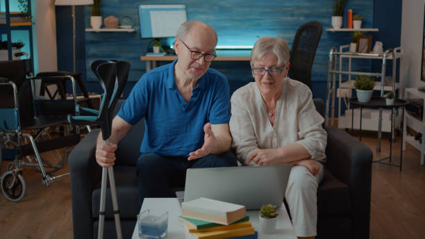 istock Senior people using laptop to talk to family on remote videoconference 1702716915