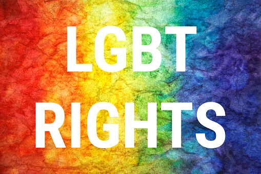 LGBT rights words on LGTB textured background.
