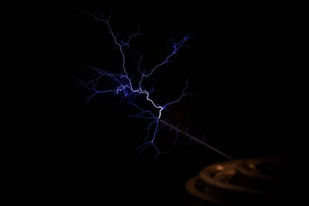 istock T coil electrical resonant transformer circuit high voltage power generator, electric lightning, object detail, closeup, nobody. Inventions, electric energy abstract concept, symbol 1702732415