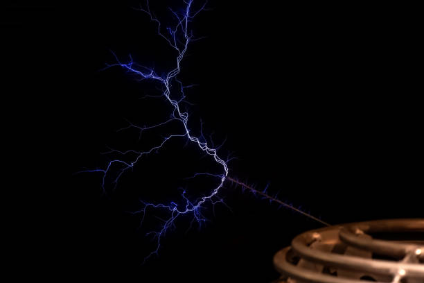istock Tesla coil electrical resonant transformer circuit high voltage power generator, electric lightning, object detail, closeup, nobody. Nikola Tesla inventions, electric energy abstract concept, symbol 1702732427