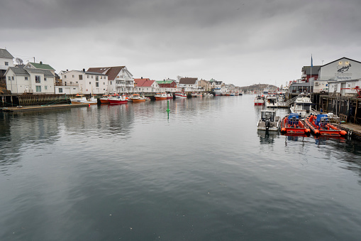 Henningsvaer  Vagan Nordland Lofoten archipelago Norway on  March 17, 2022:  Scenic view of the waterfront harbor by sunset in winter, is a fishing village and tourist town located on Austvagoya island.