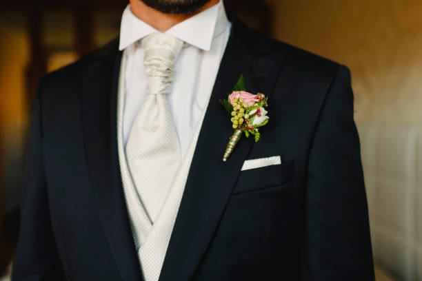 istock Groom dressing to go to his wedding 1702737468