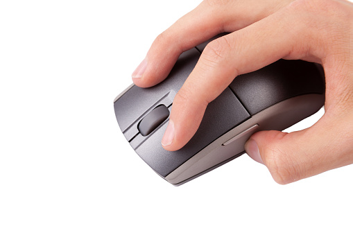 Man clicking the left mouse button on a generic modern wireless PC mouse, object closeup, isolated on white background, cut out, detail. Left click concept, hand holding mouse gesture, one person