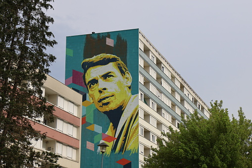 Portrait of singer Jacques Brel painted on a building wall, town of Vesoul, department of Haute Saône, France