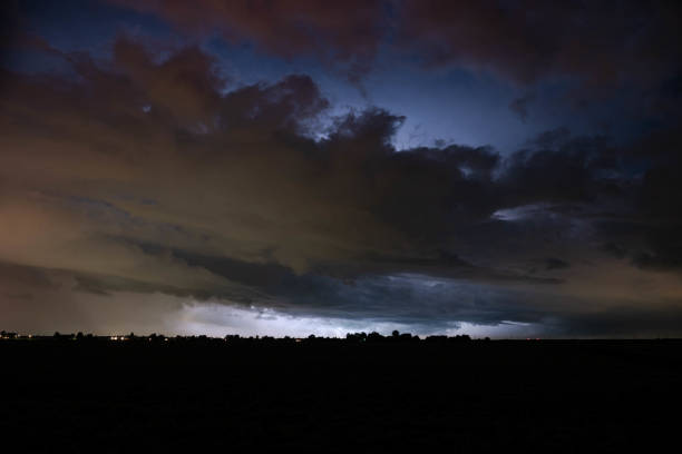 istock Menacing stormy sky is illuminated by lightning 1702758863