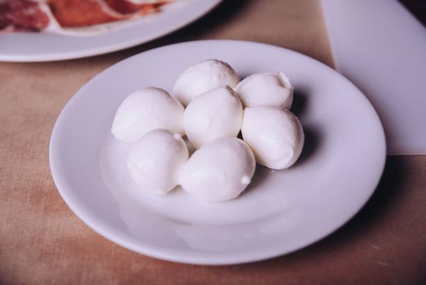 istock White plate filled with round, freshly made mozzarella balls 1702760522