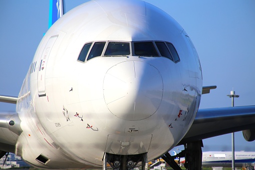 Airplane parked at the airport. Parked perfectly on the spot.