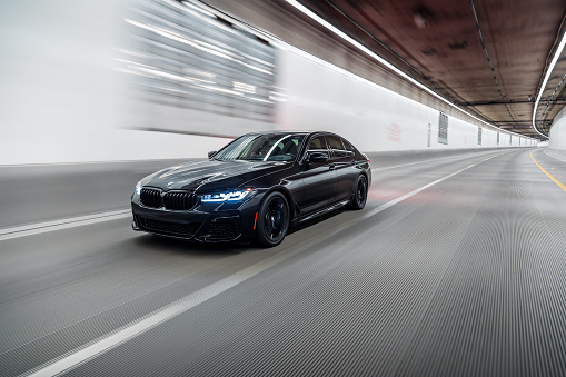 Seattle, WA, USA\nSeptember 26, 2023\nBlack BMW 550i driving in a tunnel