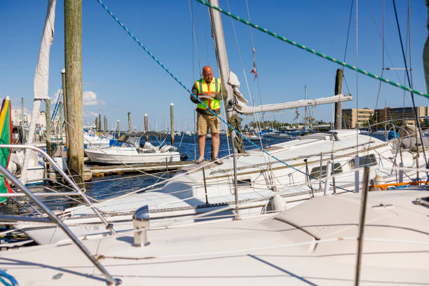 istock Ship assessment due to drowned bow. Mature insurance inspector with digital tablet investigating yacht prow for compensation analysis 1702806002