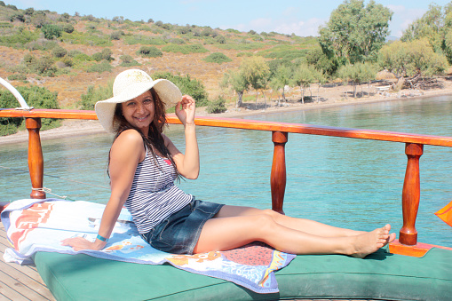 attractive girl yachting in swimwear relax on vacation cruise trip