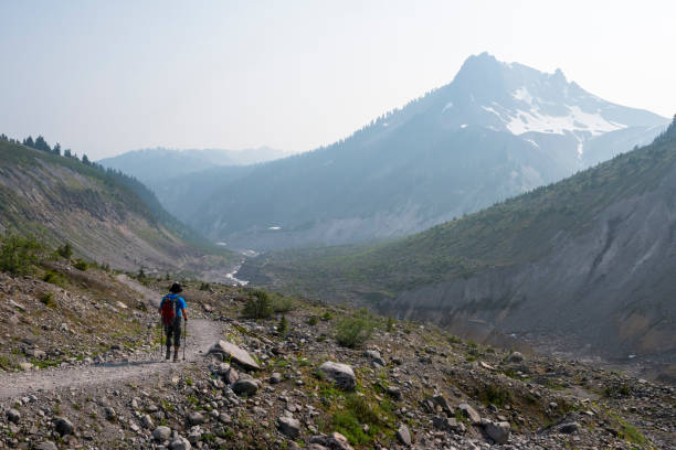 istock Solo man hiking in a vast mountain wilderness 1702826950