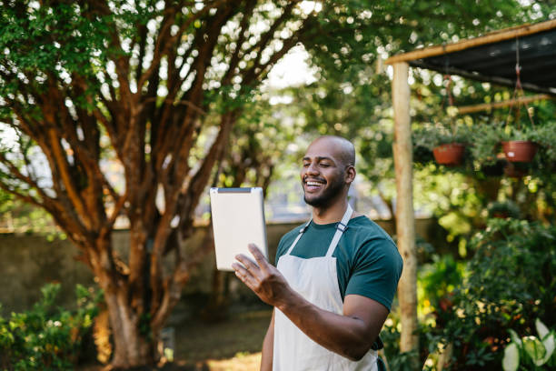 istock Gardening store owner on video call on tablet 1702831966