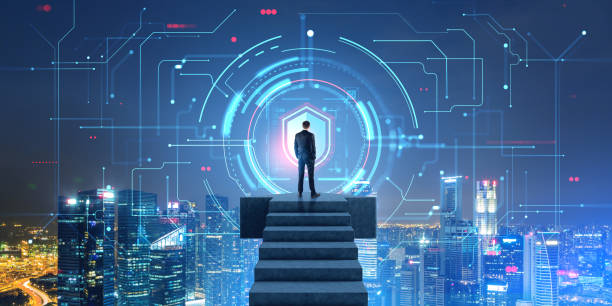 istock Man on stairs looking at cyber security interface in night city 1702833054