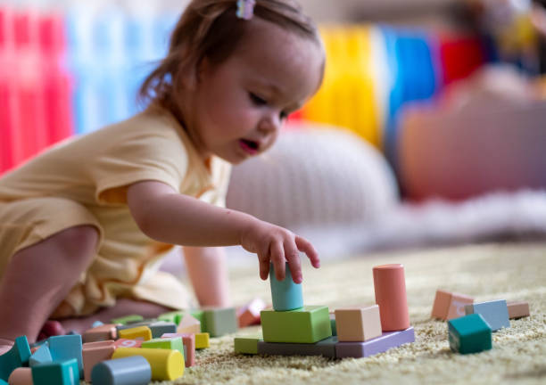 istock the baby is playing with blocks 1702843663