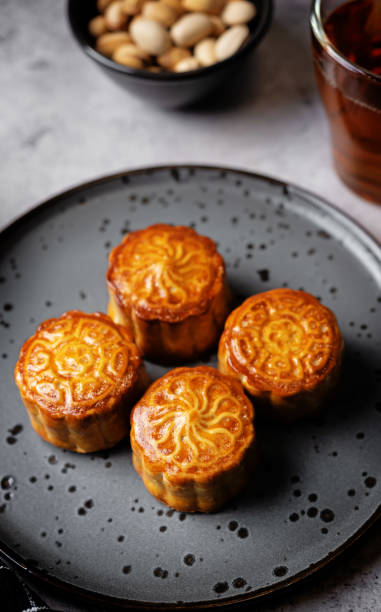 istock Moon cake with nuts in a plate 1702844226