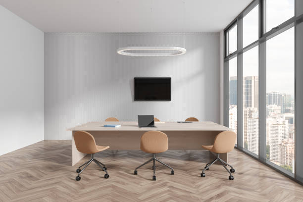 istock White office room interior with chairs and meeting table, panoramic window 1702861637