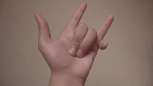 istock human sixth finger peace hand sign 1702878585