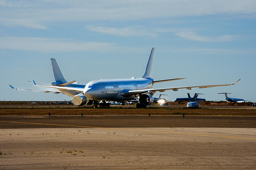 Luqa, Malta - July 21, 2023: World 2 Fly Airbus A330-343 (Reg.: CS-TRH) departing Malta after having been painted in this airline's color scheme, arrived in yellow paint on June 23rd.