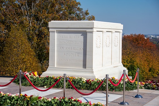 Arlington County, United States – November 10, 2021: a closeup of The Tomb of the Unknown Soldier surrounded by flowers in Vietnam